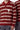 Pull polo Thomas Rouge en maille rayée, zoom sur le col polo boutonné et le cœur smiley blanc sur la poitrine