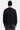 Cardigan Tiago Noir en maille porté par un homme, de dos, avec bonnet noir et jean noir