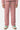 Jogging Tika Rose Bandana porté de face, cordon tressé multicolore, écusson brodé et baskets blanches