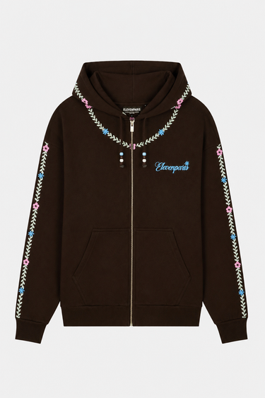 Sweat à capuche zippé Tina Marron à plat de face, broderie florale sur les manches et inscription Elevenparis bleue