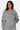 Sweat à capuche zippé Tindra Gris Chiné porté de face par une femme, logo EB, étoile et écussons brodés
