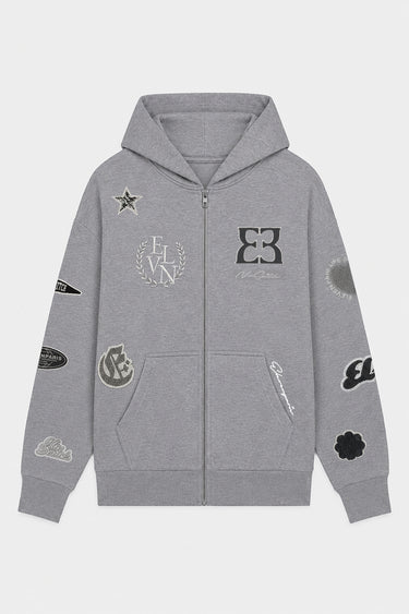 Sweat à capuche zippé Tindra Gris Chiné à plat de face, logo EB, étoile et écussons sur les manches
