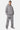 Jogging Tony Gris Chiné porté par un homme avec sweat zippé assorti, écussons brodés et baskets