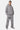 Sweat à capuche zippé Tindra Gris Chiné porté par un homme, écussons brodés noirs et logo EB sur la poitrine