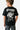 T-shirt Tolan Noir porté de dos par un garçon, grand personnage blanc Eleven Café Club
