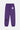Jogging Tutti Violet vu de dos à plat, fleur de lys blanche en haut de cuisse et noire en bas de jambe