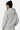 Sweat à capuche Tyson Gris Chiné porté de dos par une mannequin femme coiffée d'un bonnet noir