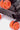 Valise Fugers Gris Foncé S, zoom sur les roulettes orange marquées Eleven Paris, coque noire à rivets