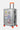 Valise Fugers Argent M de trois quarts, coque gris argenté, patchs colorés, poignée latérale, roulettes orange