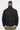 Doudoune Epolline Noir portée de dos par un homme, matelassage horizontal, avec pantalon kaki