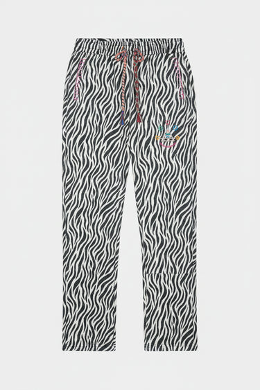 Jogging Fiby Zèbre à plat, vue de face, imprimé zèbre noir et blanc, cordons tressés et broderie colorée