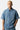 Chemise en jean Jemy Bleu Jean portée par un mannequin homme, de face, boutonnée, coeurs brodés blancs aux manches