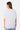 T-shirt Jerusalema Gris Chiné oversize porté par une mannequin femme, vue de dos, jean clair