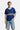 Maillot Jfrance Bleu porté par un mannequin homme, de face, numéro 10, avec short en jean à coeurs brodés