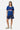 Maillot Jfrance Bleu porté avec un short bleu marine imprimé, mannequin femme en pied, baskets beiges