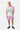 T-shirt Jovann Écru en mesh à épaules roses porté par un mannequin homme blond, numéro 03, short rose assorti, vue en pied