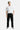 Pantalon cargo Juede Noir porté en pied par un mannequin homme, poches à rabat, cordon, avec t-shirt blanc Eleven