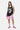 Débardeur de basket Junior Noir porté en pied par une mannequin femme avec short rose assorti et baskets roses et vertes