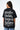 T-shirt Lys Noir delavé porté par une mannequin femme, vue de dos avec grande inscription Another Fucking Bonjour Madame