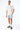 Maillot de bain Nibby Gris porté par un homme avec t-shirt écru et mocassins kaki, de face en pied