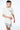 Maillot de bain Nibby Gris porté par un homme en t-shirt écru ElevenParis, plan taille, de trois quarts