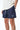 Maillot de bain Nibby Bleu nuit, plan rapproché sur le cordon blanc et le patch coeur blanc, main dans la poche