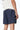 Maillot de bain Nibby Bleu nuit vu de dos en plan rapproché, inscription elevenparis blanche sur la ceinture