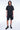 Short Ninon Noir délavé porté par un homme avec t-shirt assorti, de face en pied, effet vieilli anthracite