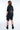 T-shirt Noemie Noir délavé porté avec un short assorti, vue de dos, fleur de lys et motifs gothiques gris