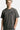 T-shirt Passau Gris Délavé porté par un mannequin homme, plan buste de face, petit emblème fleur de lys sur la poitrine