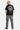 Pantalon cargo Suede Gris porté vu de dos par un mannequin homme, avec t-shirt noir à grand imprimé dans le dos