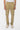 Pantalon cargo Suede Beige porté de face, poches à rabat à pressions et boutons-pressions aux chevilles