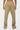 Pantalon cargo Suede Beige porté vu de dos par une mannequin femme, bas de jambe froncé