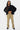 Pantalon cargo Suede Beige porté de face par une mannequin femme, mains sur la chemise noire, poches à rabat
