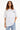 T-shirt Lys Blanc oversize porté de face par une mannequin femme, texte noir sur la poitrine, jean bleu clair