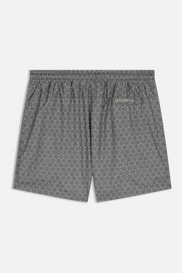 Maillot de bain Jamaique Kaki vu de dos à plat, motif graphique vert et petite poche arrière