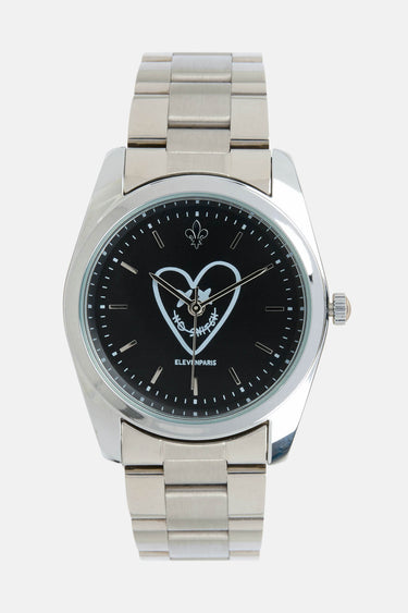 Montre Elad Noir de face, bracelet en acier, cadran noir avec grand coeur blanc et inscription ElevenParis