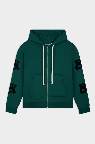 Sweat à capuche zippé Fizz Vert de face à plat, cordons blancs, poche kangourou et lettrages noirs sur les manches