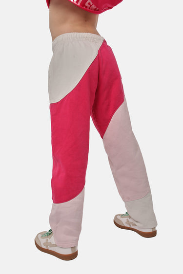 Jogging Flea Rose bicolore rose fuchsia, écru et rose pâle porté de trois quarts dos par une fillette