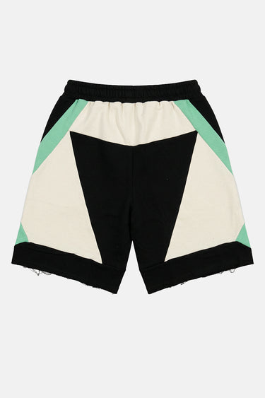 Short Judicael Noir vu de dos à plat, panneaux noir, écru et vert menthe, ourlets bruts effilochés