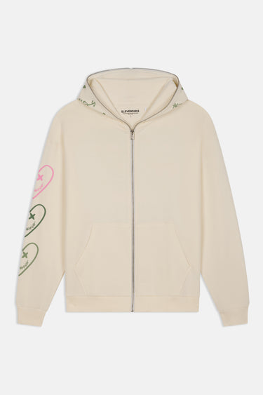 Sweat à capuche zippé Pyroma Écru à plat, de face, trois cœurs rose et vert sur la manche, fermeture éclair métal