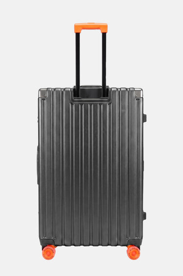 Valise Fugers Gris Foncé M vue de dos, coque rainurée gris anthracite, poignée télescopique et roulettes orange
