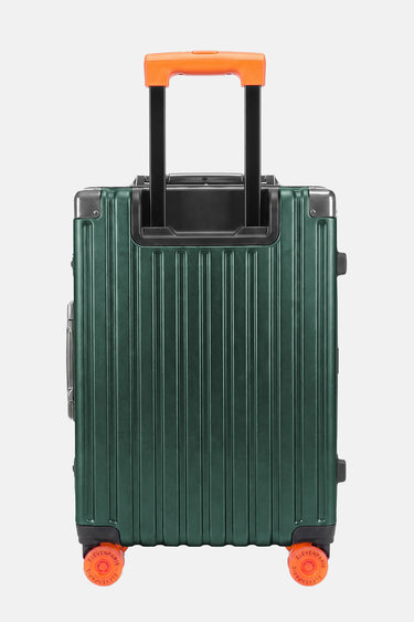 Valise Fugers Vert S vue de dos, coque rainurée vert forêt, poignée télescopique et roulettes orange