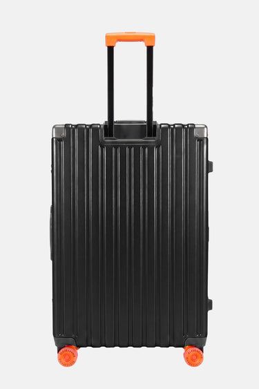 Valise Fugers Noir M vue de dos, coque rainurée noire, poignée télescopique et roulettes orange
