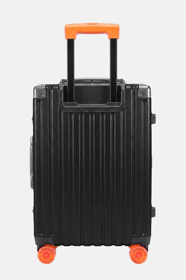 Valise Fugers Noir S vue de dos, coque rainurée noire, poignée télescopique et roulettes orange