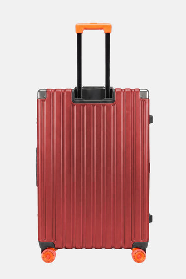 Valise Fugers Rouge M vue de dos, coque rainurée rouge bordeaux, poignée télescopique et roulettes orange